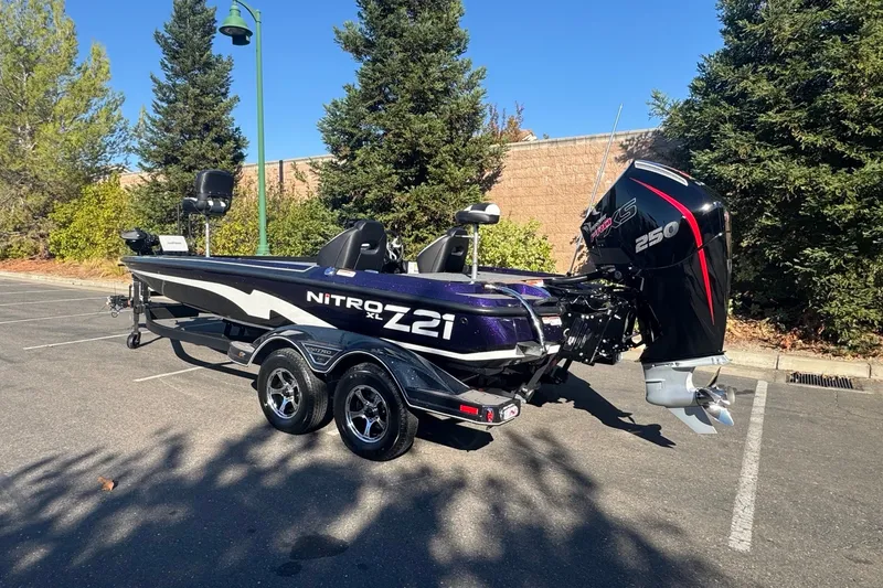 Slide: The Image of 2027 Nitro Z21 XL Pro boat with powerful engine, parked outdoors. - 4
