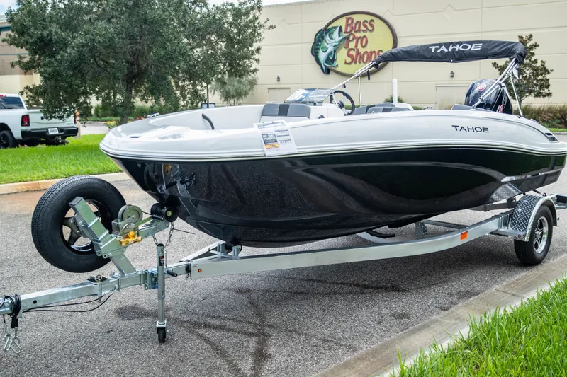 Slide: The Image of 2027 Tahoe T18 boat on trailer outside Bass Pro Shops, ready for adventure. - 4