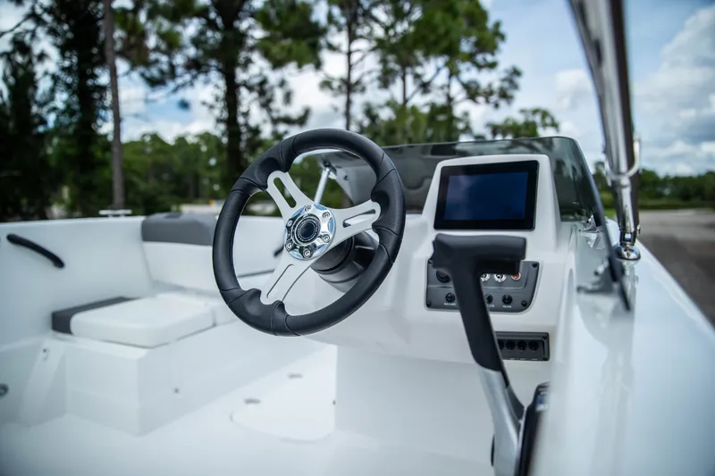 Slide: The Image of Steering console of 2027 Tahoe T18 boat with modern controls and display. - 9