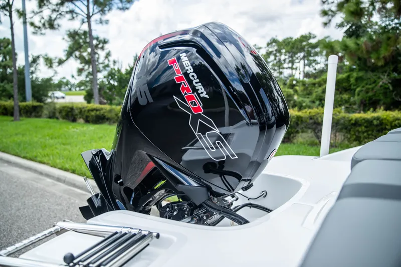 Slide: The Image of 2027 Tahoe T18 boat with Mercury Pro XS outboard motor, parked outdoors. - 8