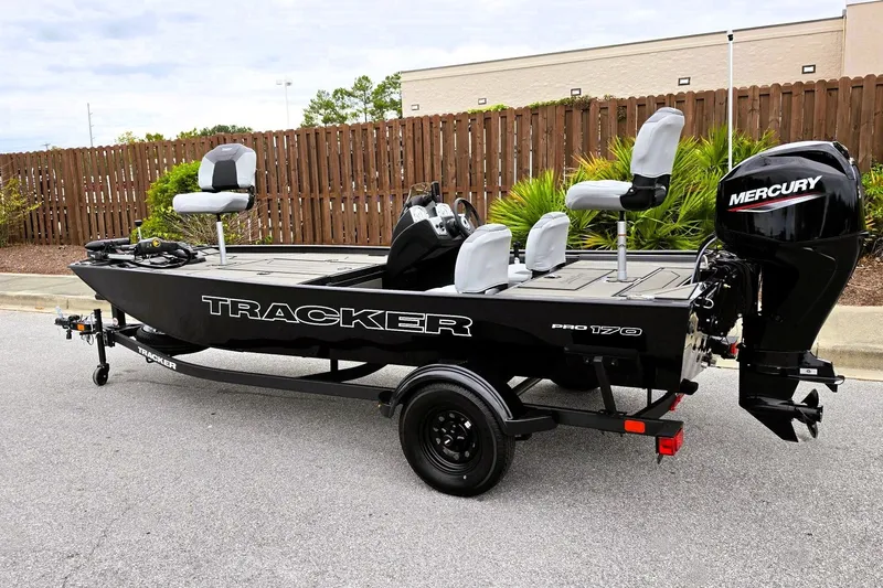 Slide: The Image of 2027 Tracker Pro 170 fishing boat with Mercury engine, parked outdoors. - 13