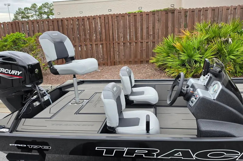 Slide: The Image of 2027 Tracker Pro 170 boat interior with seating and Mercury engine. - 17