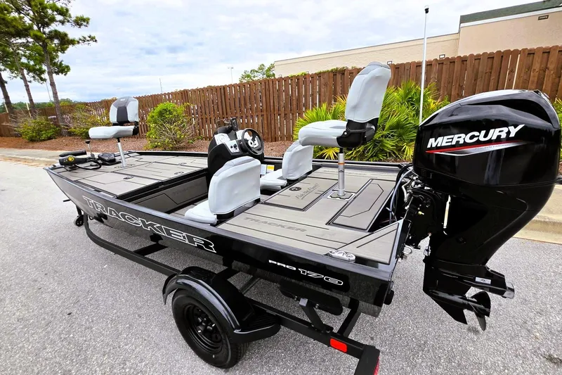Slide: The Image of 2027 Tracker Pro 170 boat with Mercury engine, parked on a street. - 15