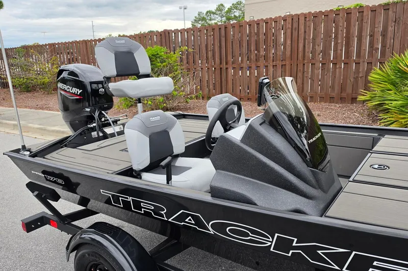 Slide: The Image of 2027 Tracker Pro 170 boat with Mercury engine, sleek design, and comfortable seating. - 18