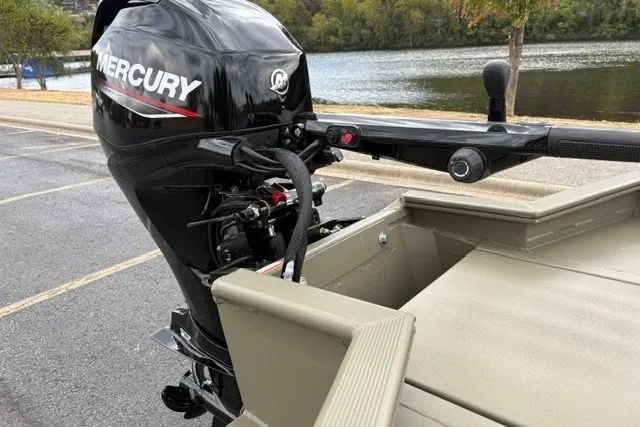 Slide: The Image of 2027 Tracker Grizzly 1553 Timber boat with Mercury outboard motor by a lake. - 22