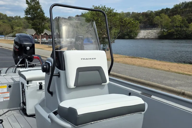 Slide: The Image of 2027 Tracker Bass Tracker Classic CC boat by a scenic river. - 15