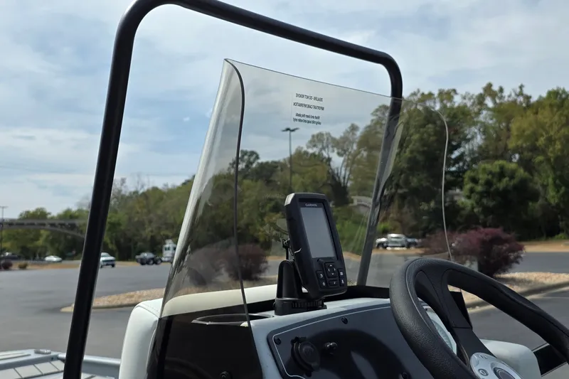 Slide: The Image of 2027 Tracker Bass Tracker Classic CC console with windshield and mounted Garmin device. - 17