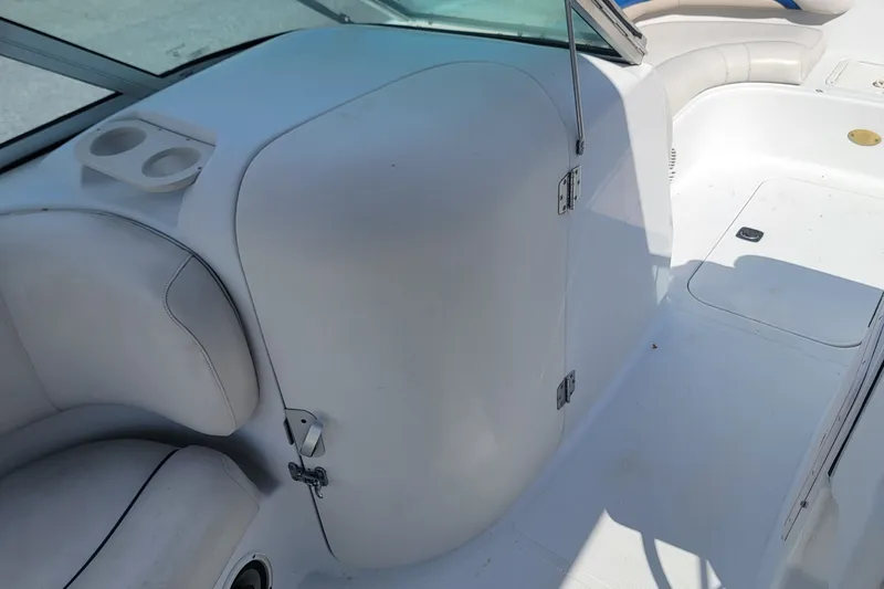 Slide: The Image of 2001 Hurricane SunDeck 217 OB boat interior with seating and storage compartment. - 10
