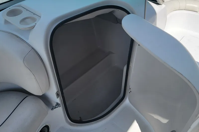 Slide: The Image of 2001 Hurricane SunDeck 217 OB boat interior storage compartment with cup holders. - 11