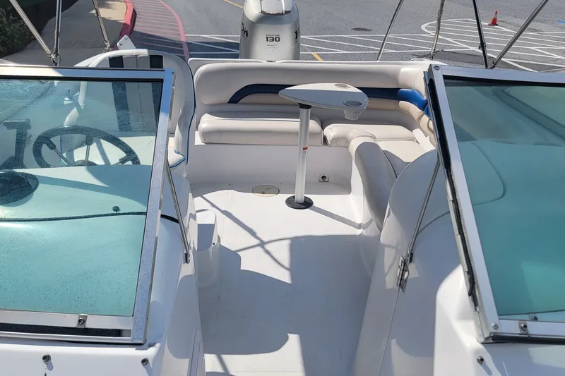 Slide: The Image of 2001 Hurricane SunDeck 217 OB boat interior with seating and table. - 14