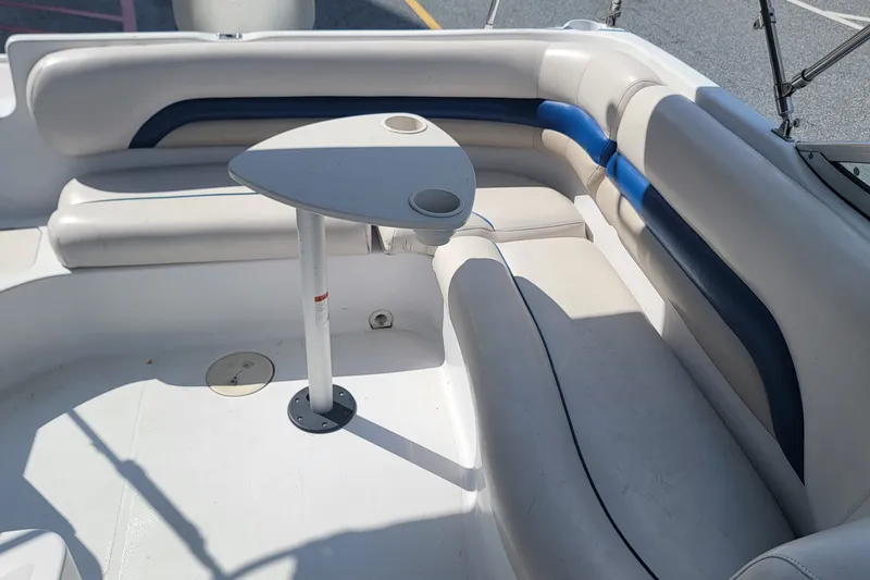 Slide: The Image of Interior of a 2001 Hurricane SunDeck 217 OB boat with seating and table. - 15