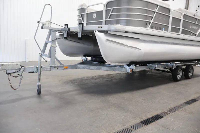Slide: The Image of 2021 Sweetwater 2086C pontoon boat on a trailer in a garage setting. - 38