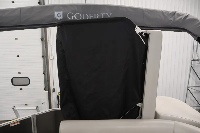 Slide: The Image of 2021 Sweetwater 2086C boat with Godfrey canopy in indoor storage. - 28