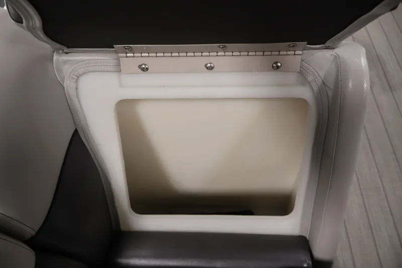 Slide: The Image of Open storage compartment in a 2021 Sweetwater 2086C boat seat. - 22