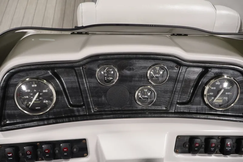 Slide: The Image of Dashboard of 2021 Sweetwater 2086C boat with gauges and controls. - 14