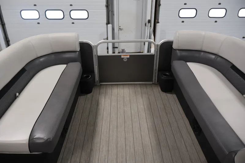 Slide: The Image of Interior of 2021 Sweetwater 2086C pontoon boat with gray seating and wood-style flooring. - 7