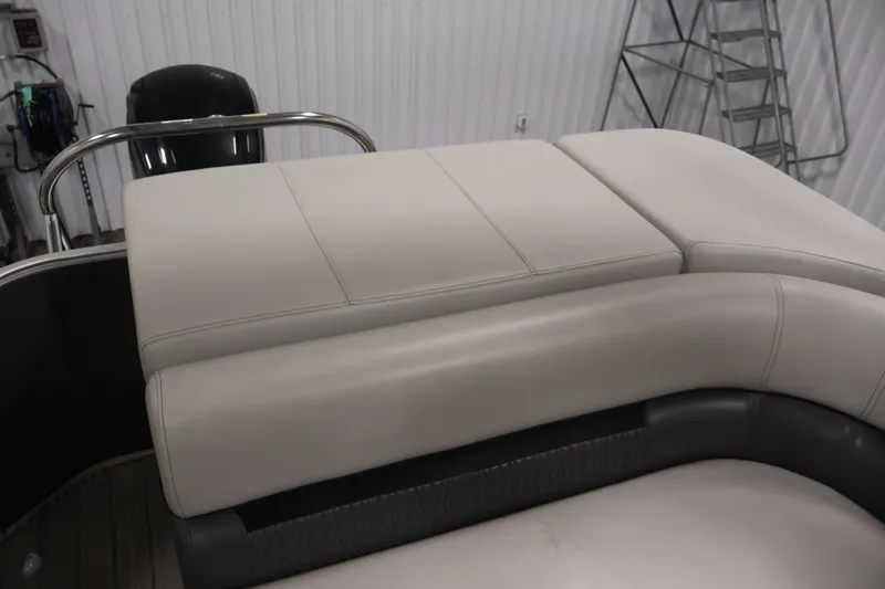 Slide: The Image of Luxurious seating on 2021 Sweetwater 2086C pontoon boat in a showroom setting. - 26
