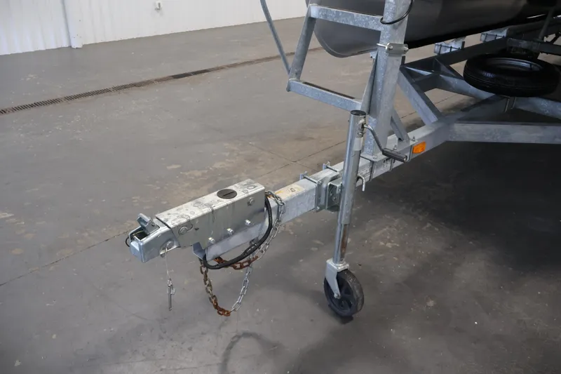 Slide: The Image of Trailer hitch of a 2021 Sweetwater 2086C boat trailer in a warehouse setting. - 36