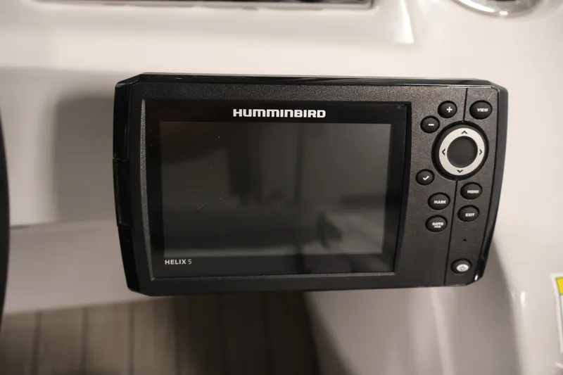 Slide: The Image of Humminbird Helix 5 fish finder on a 2021 Sweetwater 2086C boat dashboard. - 18