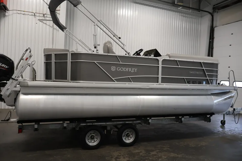 Slide: The Image of 2021 Sweetwater 2086C pontoon boat on trailer in indoor storage facility. - 3