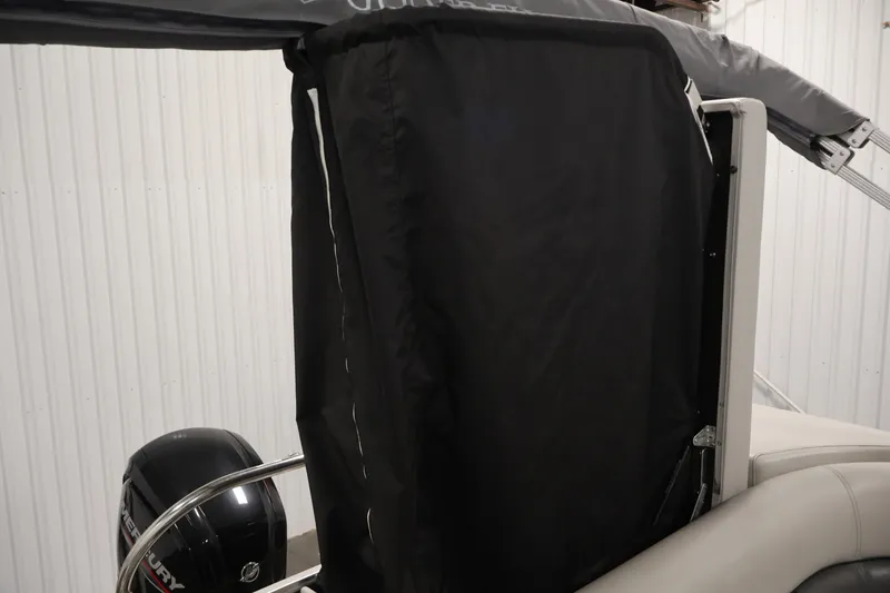 Slide: The Image of 2021 Sweetwater 2086C boat with black cover and Mercury outboard motor. - 27