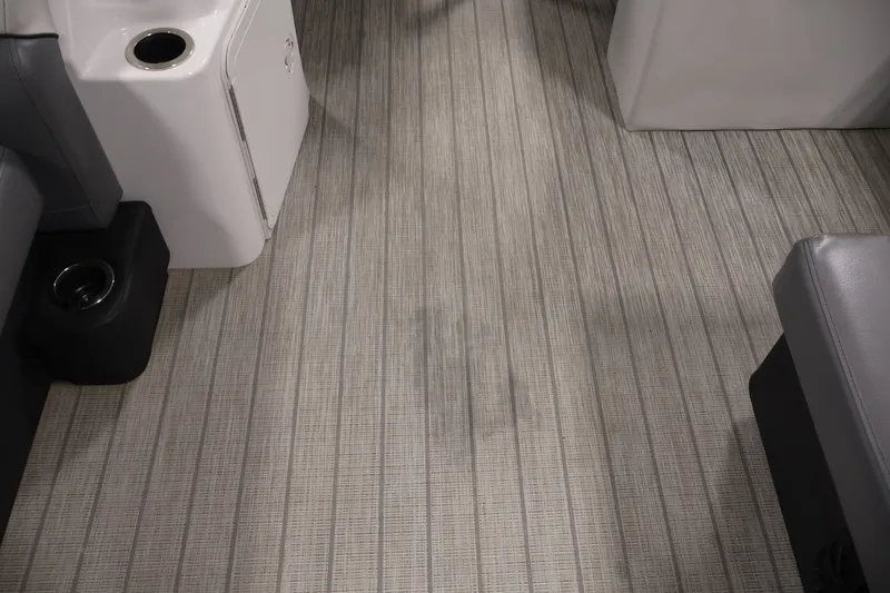 Slide: The Image of Interior flooring of a 2021 Sweetwater 2086C boat, featuring gray textured design. - 44