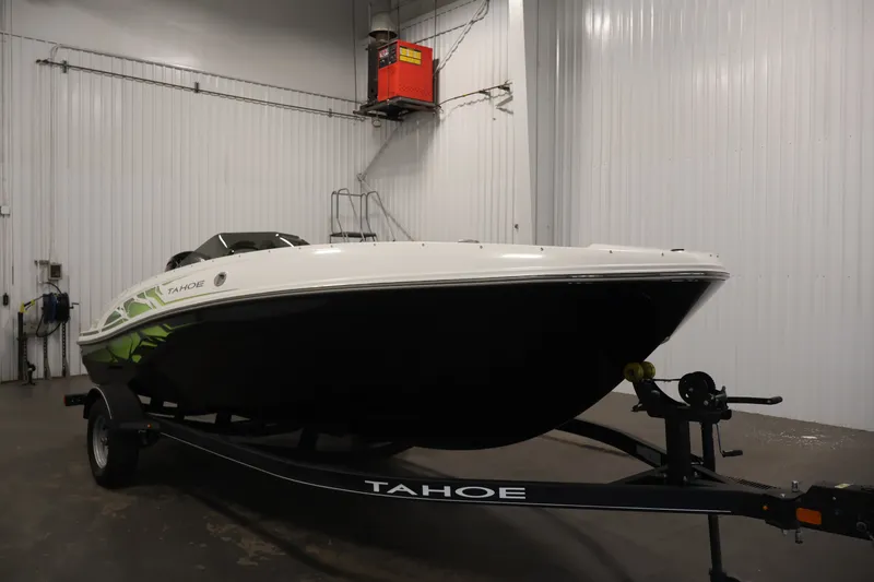 Slide: The Image of 2022 Tahoe T18 boat on trailer in indoor storage facility. - 2