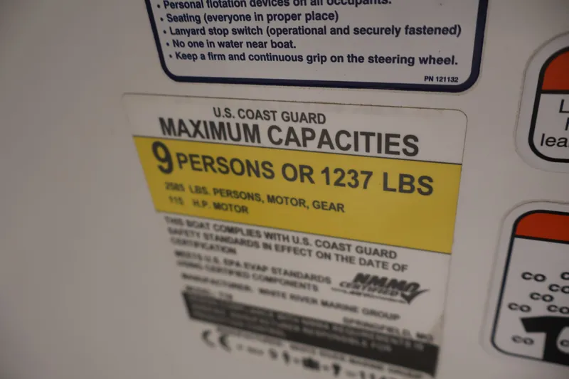 Slide: The Image of 2022 Tahoe T18 capacity label: 9 persons or 1237 lbs, U.S. Coast Guard compliant. - 21