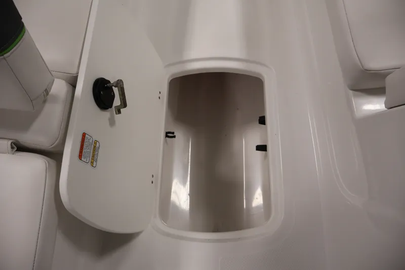 Slide: The Image of Open storage compartment in 2022 Tahoe T18 boat interior. - 29