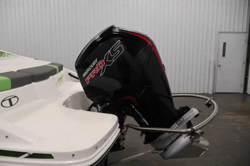 Slide: The Image of 2022 Tahoe T18 boat with Mercury Pro XS outboard motor in a garage. - 34