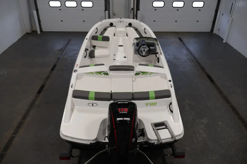 Slide: The Image of 2022 Tahoe T18 boat in a garage, featuring a Mercury 115 engine. - 9