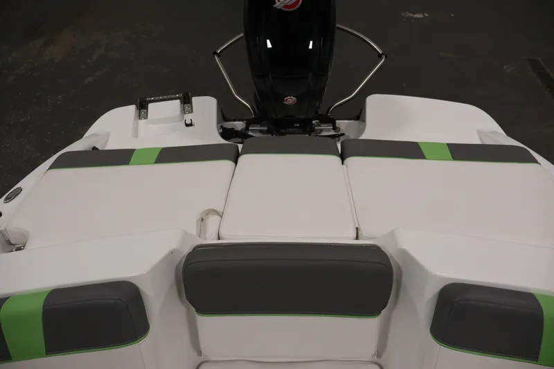 Slide: The Image of 2022 Tahoe T18 boat interior with gray and green cushioned seating. - 30