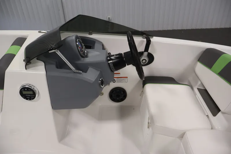 Slide: The Image of 2022 Tahoe T18 boat interior with steering wheel and seating, featuring modern design elements. - 13