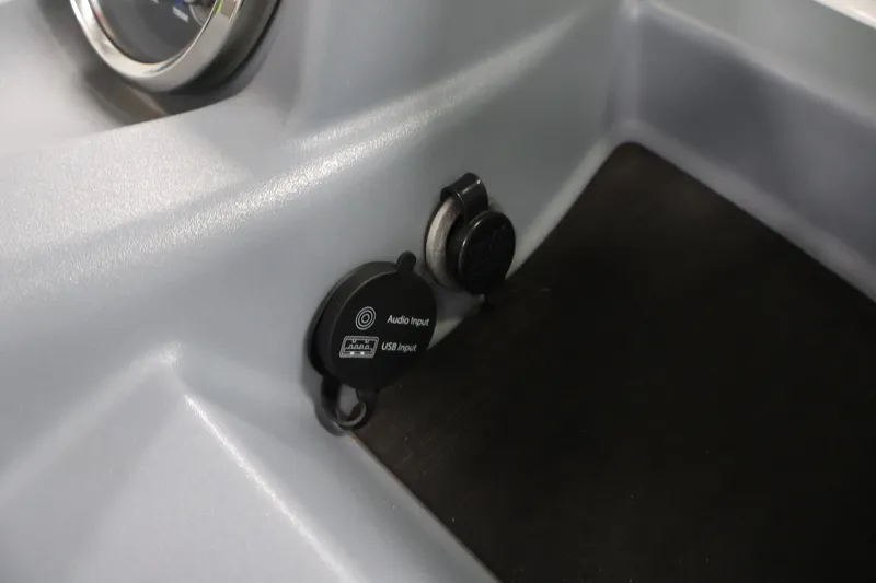Slide: The Image of 2022 Tahoe T18 boat dashboard with audio and USB input ports. - 17