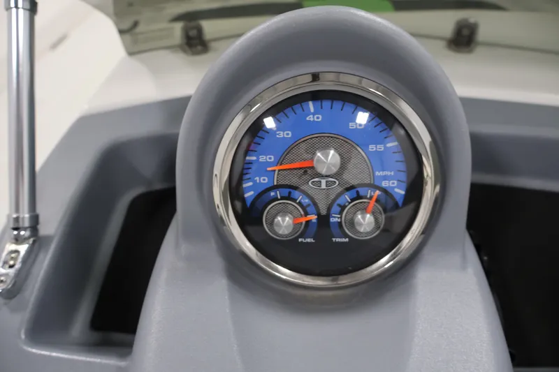 Slide: The Image of Dashboard of 2022 Tahoe T18 boat with speedometer, fuel, and trim gauges. - 16