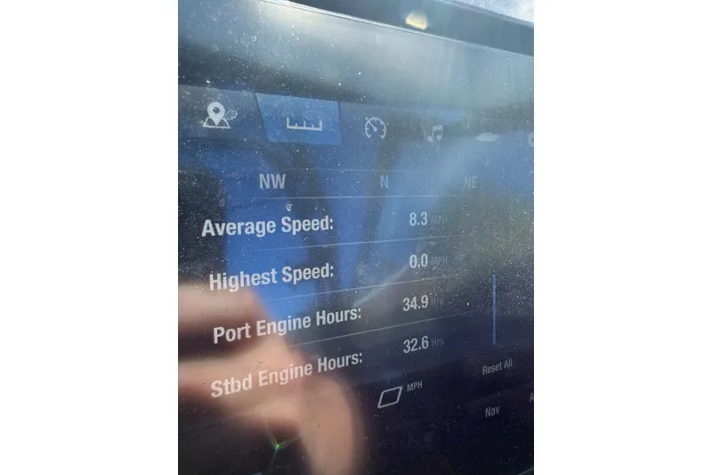 Slide: The Image of Display screen of 2026 Yamaha Boats 255XD showing speed and engine hours. - 21