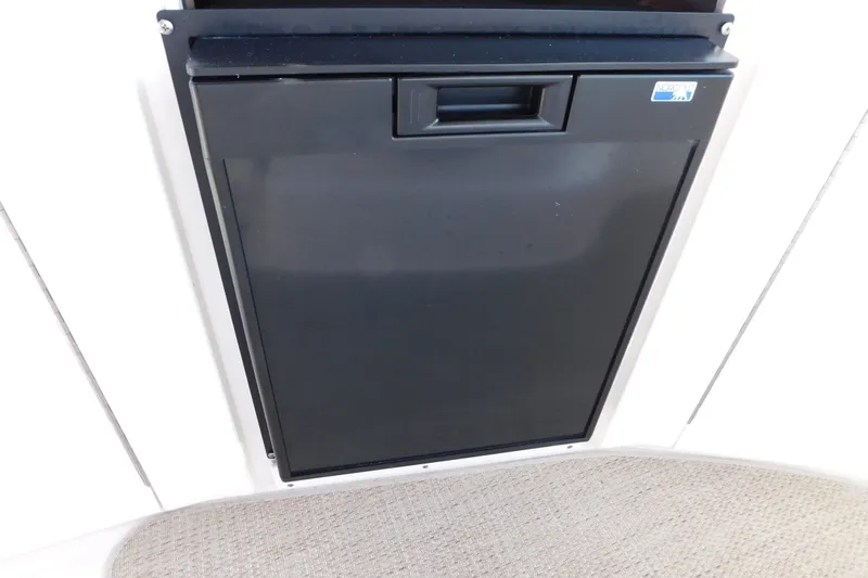 Slide: The Image of Black refrigerator door on 2001 Sea Ray 300 Sundancer boat interior. - 21