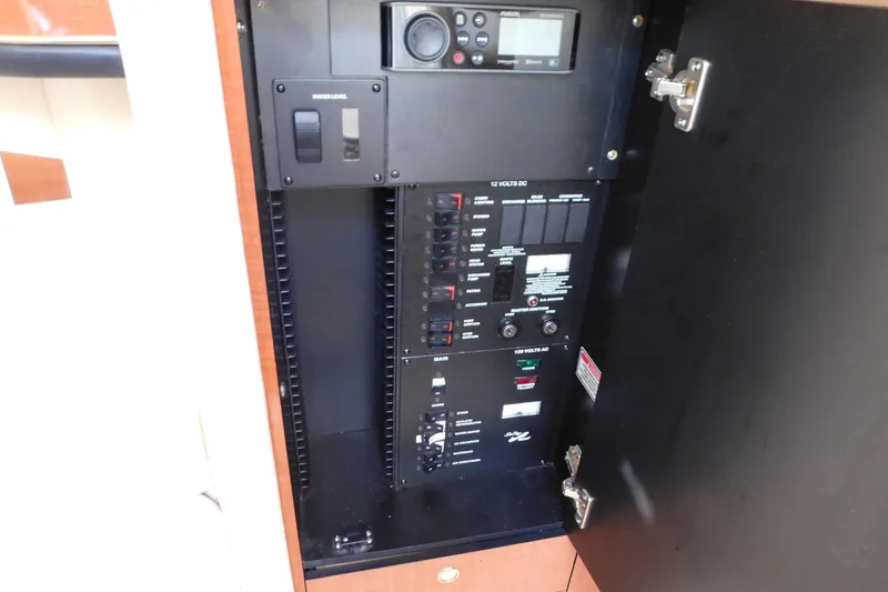 Slide: The Image of Electrical control panel inside a 2001 Sea Ray 300 Sundancer boat. - 35