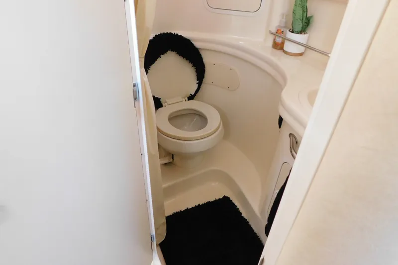 Slide: The Image of Bathroom interior of 2001 Sea Ray 300 Sundancer boat with toilet and sink. - 59