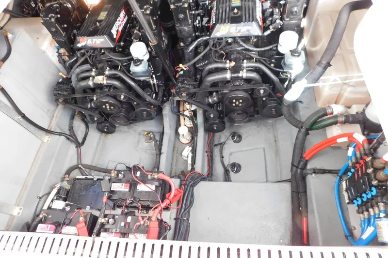 Slide: The Image of Engine compartment of a 2001 Sea Ray 300 Sundancer with dual Mercury 5.7L engines. - 68