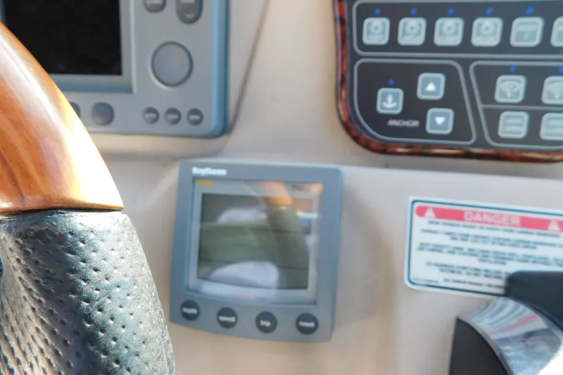 Slide: The Image of Control panel of a 2001 Sea Ray 300 Sundancer boat with navigation equipment. - 31