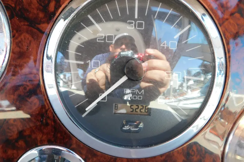 Slide: The Image of Close-up of a 2001 Sea Ray 300 Sundancer RPM gauge showing 522.6 hours. - 67