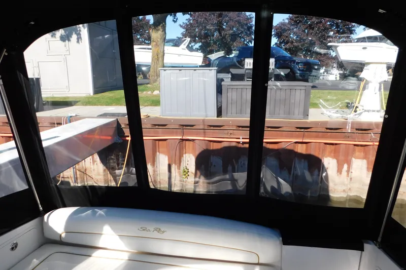 Slide: The Image of Interior view of a 2001 Sea Ray 300 Sundancer boat docked at a marina. - 9