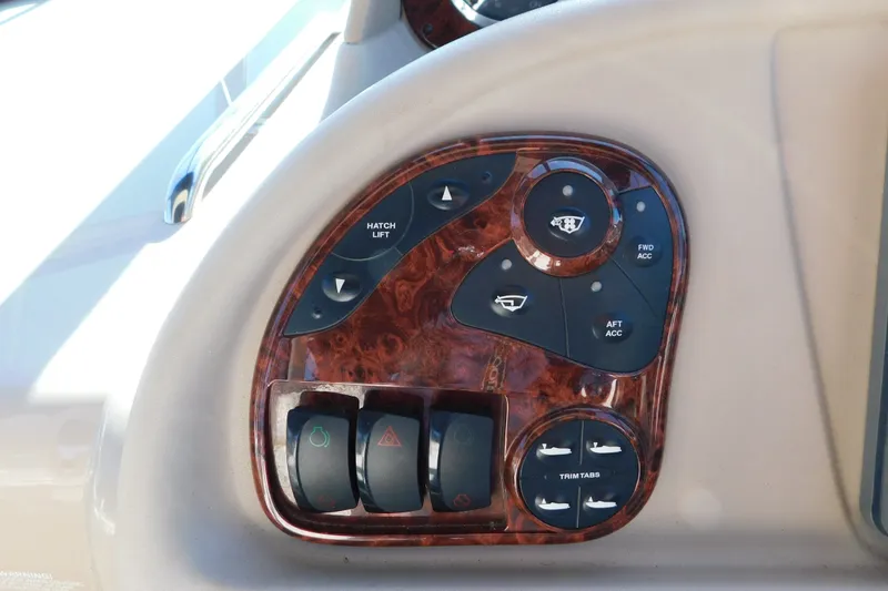 Slide: The Image of Control panel of a 2001 Sea Ray 300 Sundancer boat with wood finish. - 33