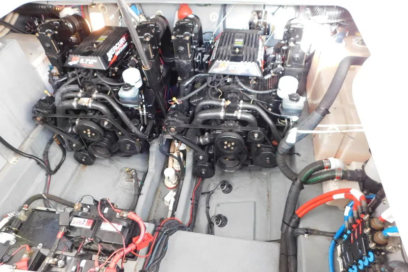 Slide: The Image of Engine compartment of a 2001 Sea Ray 300 Sundancer with dual Mercury engines. - 77