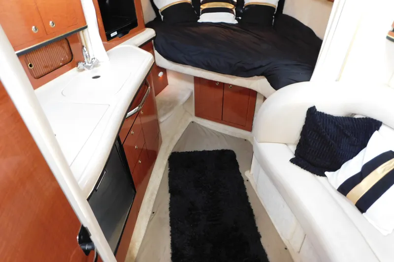 Slide: The Image of Interior of 2001 Sea Ray 300 Sundancer with cozy cabin and modern amenities. - 40