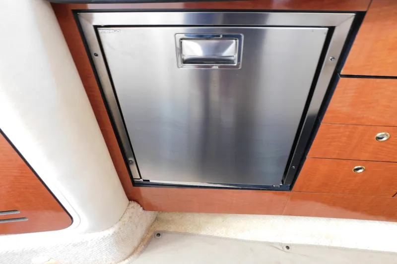 Slide: The Image of Stainless steel fridge in 2001 Sea Ray 300 Sundancer yacht interior. - 54