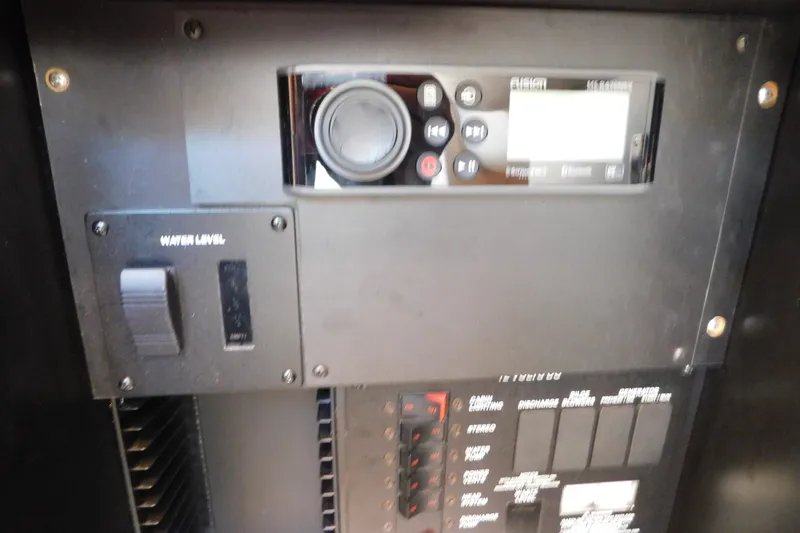 Slide: The Image of Control panel of a 2001 Sea Ray 300 Sundancer boat, featuring water level indicator. - 37