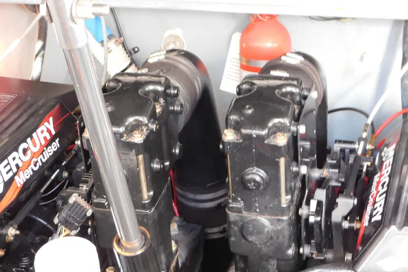 Slide: The Image of Engine compartment of a 2001 Sea Ray 300 Sundancer with MerCruiser components. - 74