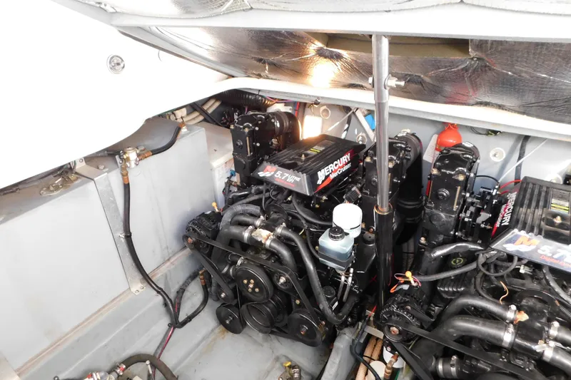 Slide: The Image of Engine compartment of a 2001 Sea Ray 300 Sundancer with twin Mercury engines. - 70